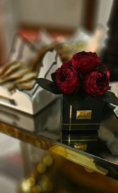 Preserved Red Peonies in a Black Marble Vase