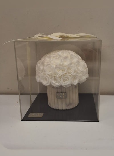 White and grey marble vase with white preserved real roses