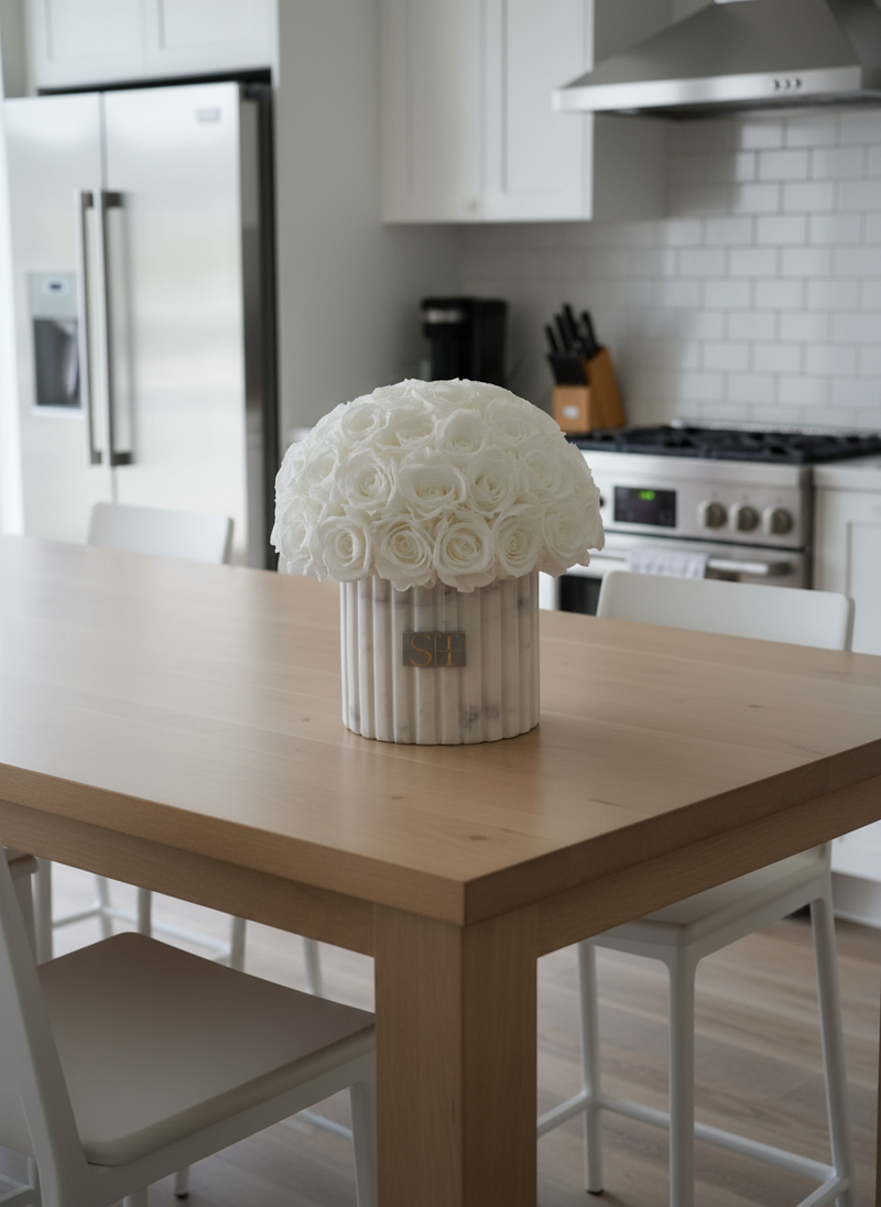 White and grey marble vase with white preserved real roses