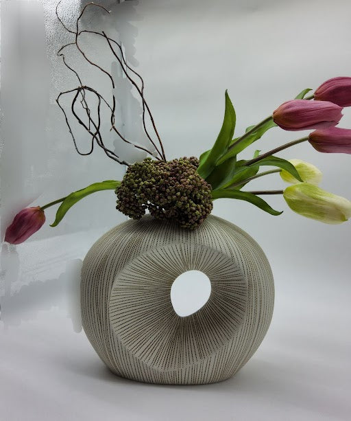 Ivory and Brown textured vase filled with pink and cream tulips, cactus and branches