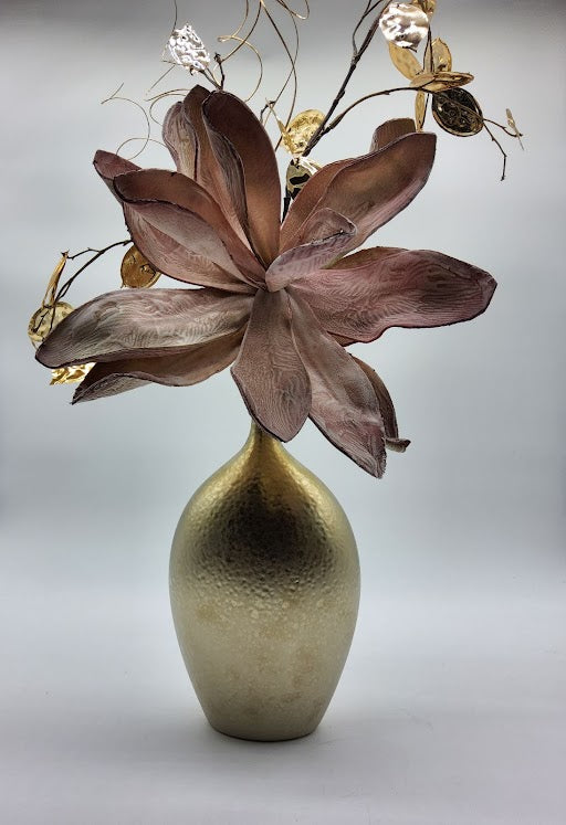 Gold vase filled with big mauve foam flower gold leaves and branches